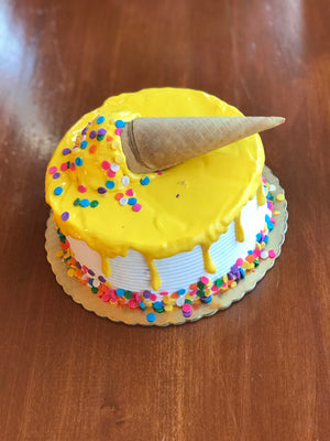 Medium Yellow Cone Drip Cake